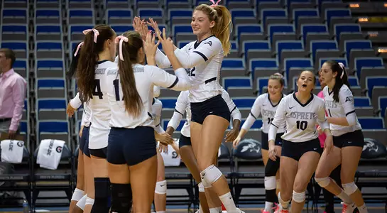 Taryn Griffey high fives teammates during pregame introductions.