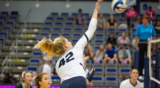 Taryn Griffey stretches her arm out to hit the volleyball.