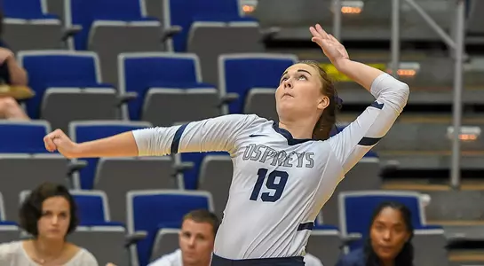Kaileen Herman rears back to serve the volleyball during a match.