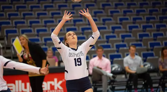 Kaileen Herman sets the volleyball.