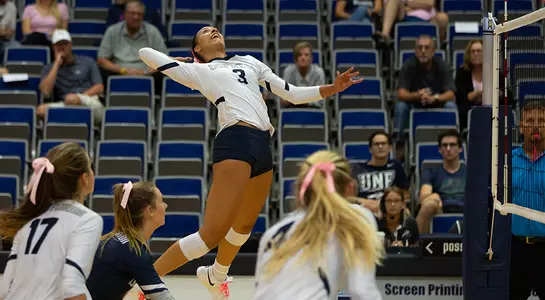 Gabby O'Connell jumps high and rears back to make an attack attempt.