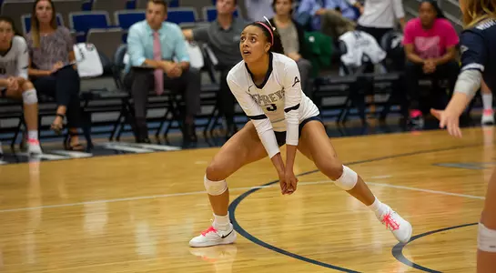 Gabby O'Connell gets in position to dig the volleyball.