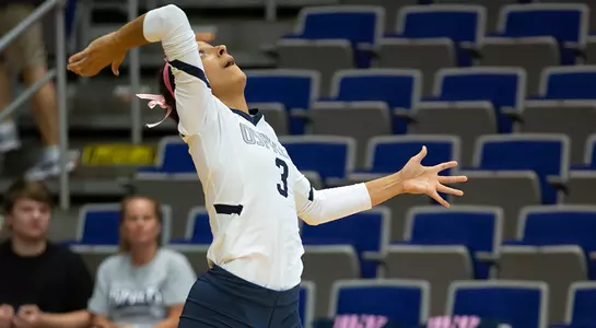 Gabby O'Connell rears her arm back to connect with a serve.