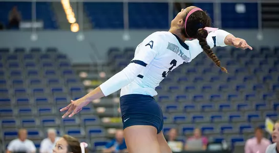 Gabby O'Connell jumps high to make contact with the volleyball.