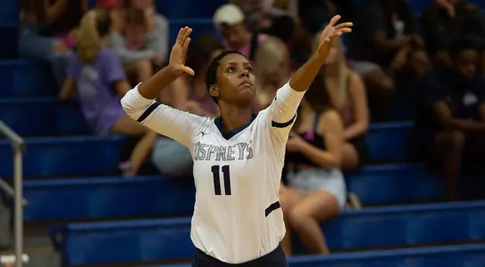 Chayari Ramos looks at the volleyball and winds up to deliver a serve.