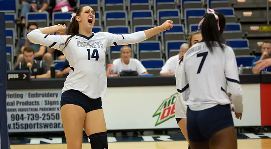 Alana Shoff celebrates a point on the volleyball court with Devyn Wheeler