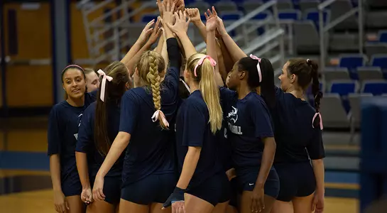 The North Florida Volleyball team gathers for a team huddle