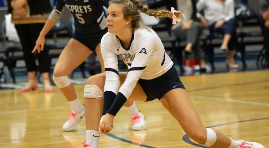 Kirby Smith bends low to get in position to dig the volleyball.