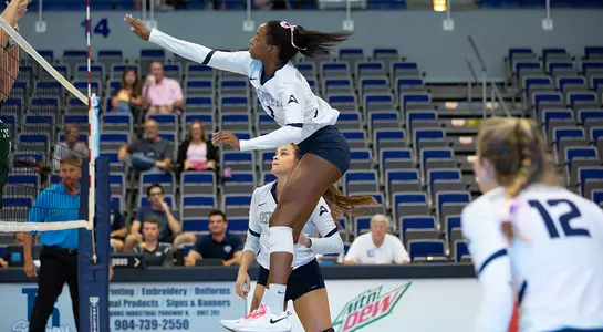 Devyn Wheeler follows through after hitting the volleyball.