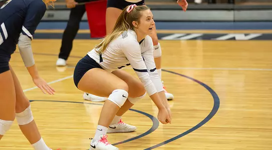 Callie Workman gets in position to dig the volleyball.
