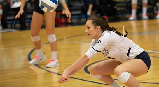 Grace Youngblood gets in the position to dig the volleyball.