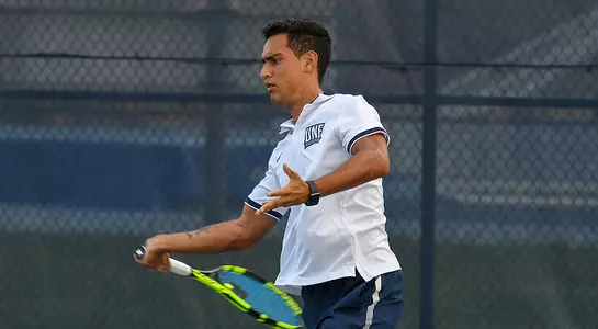 Federico Nani hits his backhand in tennis.