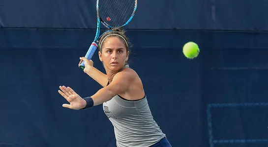 Rafaela Gomez returns the tennis ball.