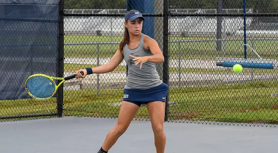 Ana Paula Melilo returns the tennis ball with her forehand.