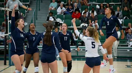 Alana Shoff, Devyn Wheeler, Solimar Cestero, Madilyn McCarty and Gabby O'Connell celebrate in the middle of the court after a point.