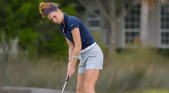 Sydney Shrader follows through on a putt