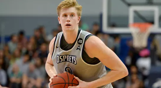 Noah Horchler passes the basketball