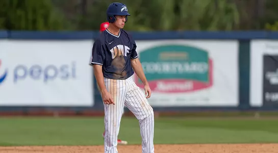 Chris Berry stands on base waiting for the next batter to bat