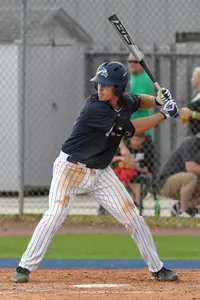 Chris Berry winds up to hit an incoming pitch