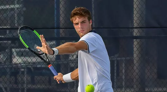 Nilo Duarte hits a forehand at the UNF tennis complex.