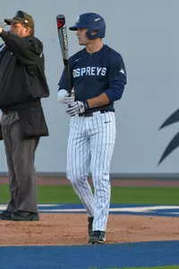 Max Law holds the bat ahead of going up to bat