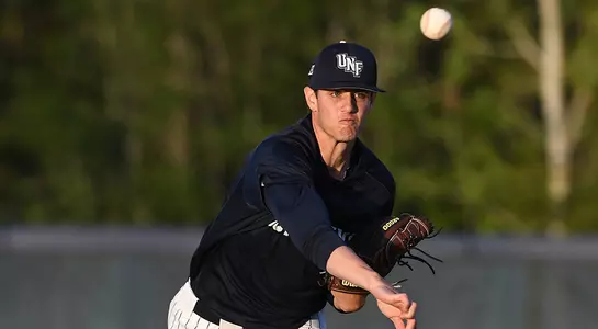 Nick Marchese follows through as he throws the baseball to a team mate