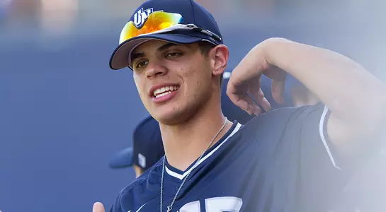 A close-up of Andrew Martinez as he adjusts his jersey