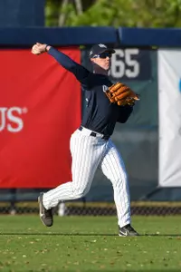 Chris Matthias winds back to throw the ball from the outfield