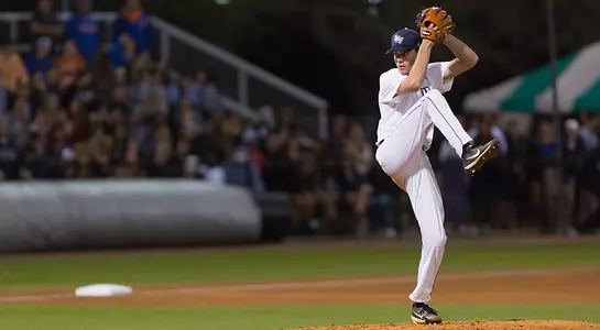 Eddie Miller winds up to pitch the ball