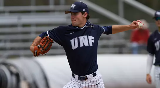 Eddie Miller winds up to pitch the ball