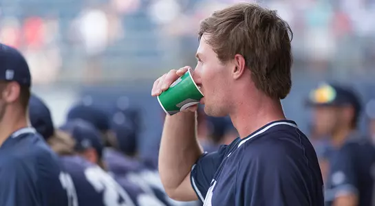 Tanner Murphy takes a sip to drink in the dugout