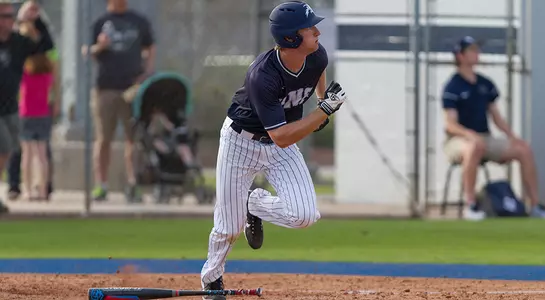 Tanner Murphy takes off towards first base after his hit