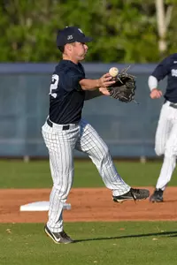 Jay Prather sidearms a ball to first base