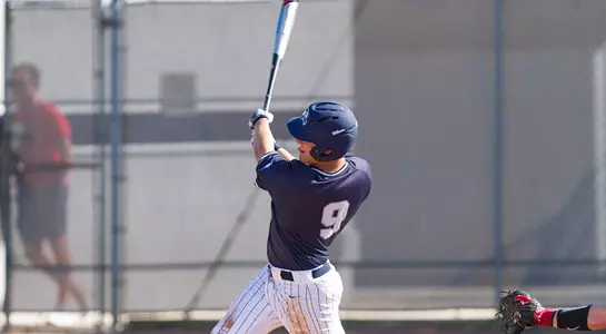 Alex Reynolds swings his bat at an incoming pitch