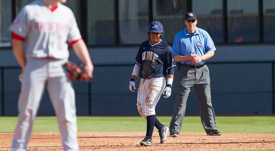 Abraham Sequera waits for the next batter to hit