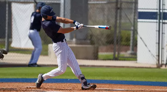 Wes Weeks swings his bat at the ball