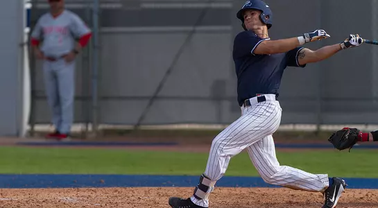Wes Weeks follows through after swinging at a pitch