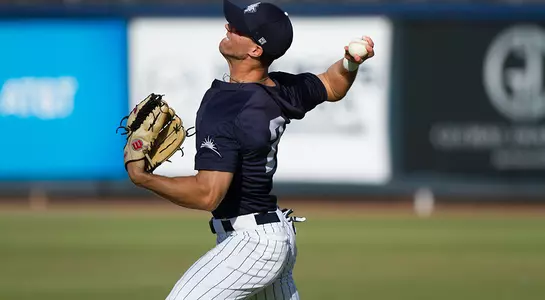 Wes Weeks winds back to throw the ball to a team mate