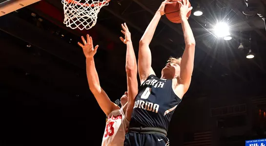 Noah Horchler grabs a rebound over a Dayton defender