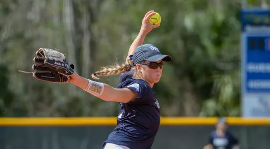 Sydney Matzko gets ready to pitch the softball.