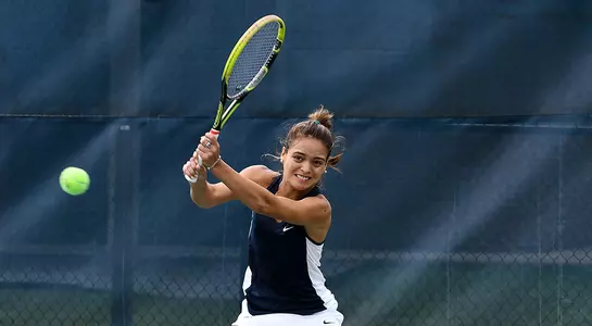 Lucia Montano returns the ball at the UNF tennis courts