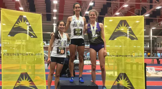 Claudia Jalon (center) and Eden Meyer (left) stand on winners podium for the ASUN 3000m championship