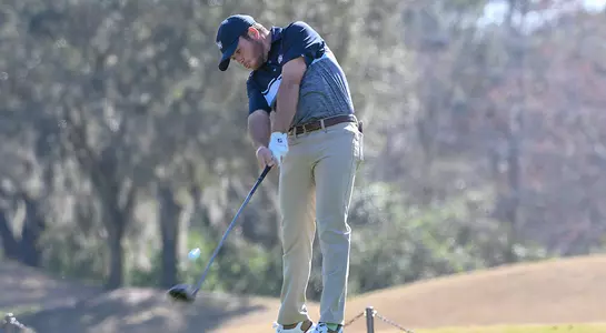 Andrew Alligood chips the ball on the golf course.