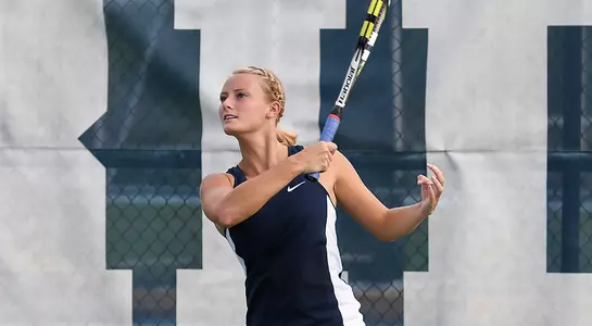 Luise Intert hits a forehand at the UNF tennis courts.