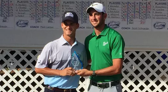 Philip Knowles poses in front of scoreboard after finishing runner-up at Gator Invitational 2018