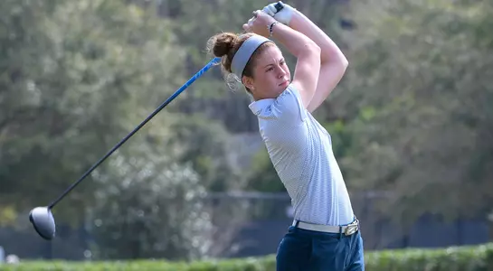 Sydney Shrader follows through after hitting a tee shot