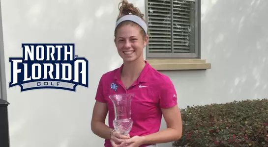 Sydney Shrader poses with trophy for winning the Amelia Island Collegiate Championship