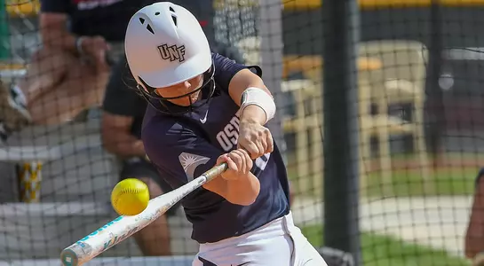 Dominica Cocuzza hits the softball at UCF Tournament.
