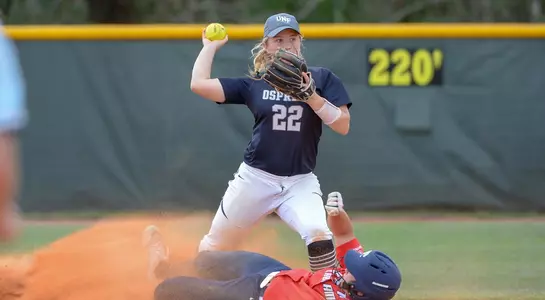 Tiffany Lower catches the ball in time for the other team to be out.