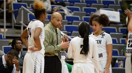 Head Coach Darrick Gibbs talks to his starters in a timeout.